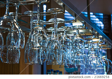 Clear glasses over bar table 21669258