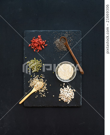 Superfoods on black chalkboard background: goji Superfoods on black chalkboard background: goji 21669306