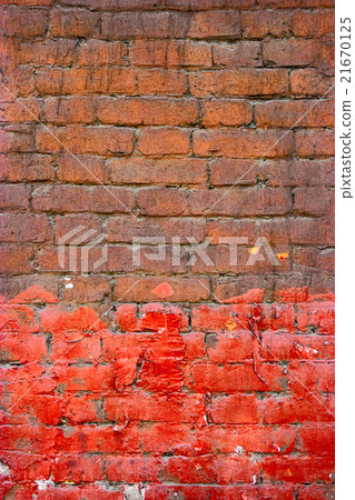Painted brick wall half brown half red color. Good 21670125