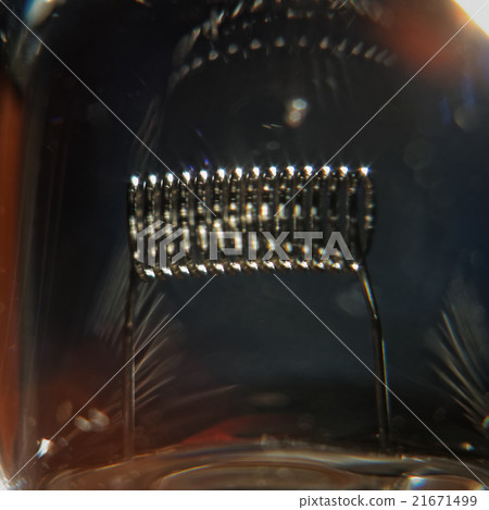 Lightbulb filament. Super macro shot, high ISO Lightbulb filament. Super macro shot, high ISO 21671499