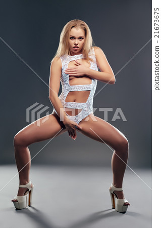 Cute go-go dancer posing in provocative pose 21673675