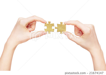 puzzle in hand isolated on white background 21674147
