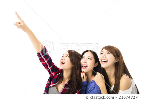 group of happy young  women looking and pointing something 21674727