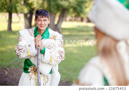 Man in traditional festive dress of steppe nomads Man in traditional festive dress of steppe nomads 21675453