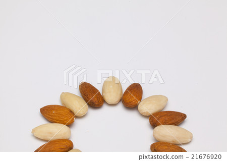 Almond nuts on the white table 21676920