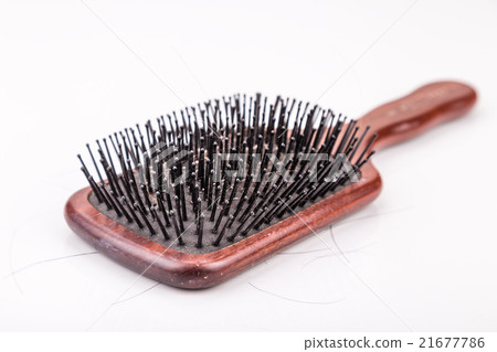 Comb with strand of hair on white background Comb with strand of hair on white background 21677786