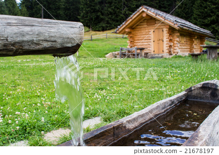 wooden trough with spring water in a farmhouse wooden trough with spring water in a farmhouse 21678197