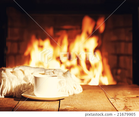 White cup of tea or coffee and woolen scarf White cup of tea or coffee and woolen scarf 21679905