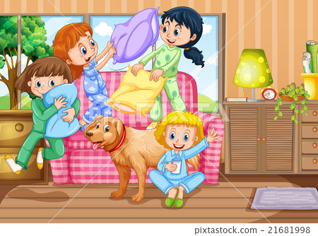 Girls playing pillow fight at slumber party 21681998