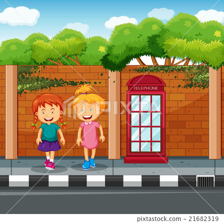 Two girls standing at the pavement Two girls standing at the pavement 21682319