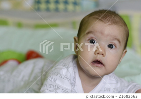 Baby girl with blue eyes learns to crawl Baby girl with blue eyes learns to crawl 21682562
