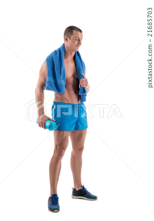 Smiling bodybuilder with shaker and towel 21685703