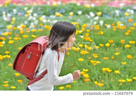 Girl running in flower garden (school bag) 21687079
