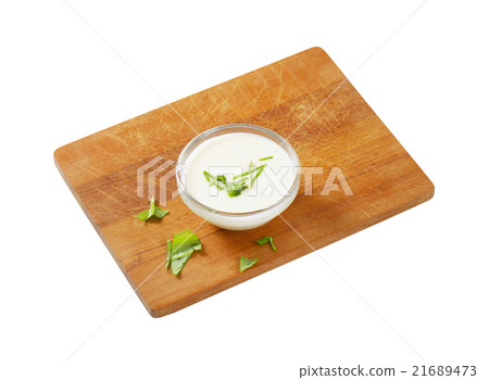 Bowl of white salad dressing 21689473