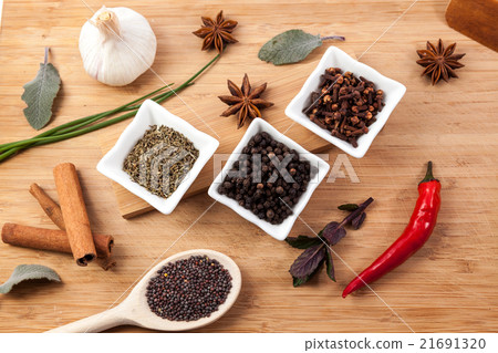 Herbs on an wouden plate 21691320