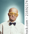 Bald man in fashion glasses 21692174