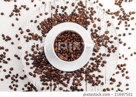 Coffee cup and beans on a white background. Coffee cup and beans on a white background. 21697581