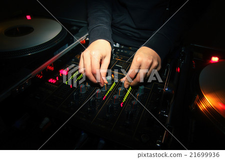 Female DJ playing music on vinyl 21699936