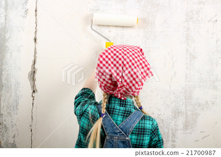 blonde little girl doing repairs in the apartment blonde little girl doing repairs in the apartment 21700987