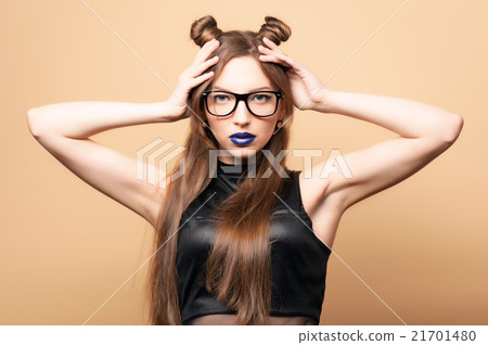 Beautiful young woman in glasses 21701480