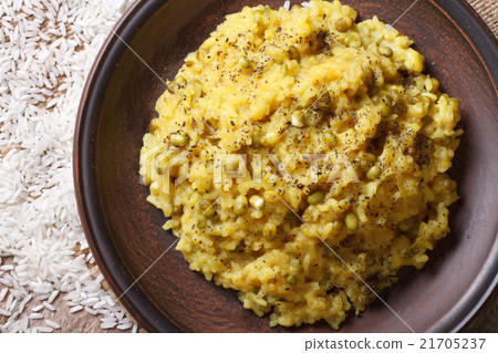 Khichdi with rice and mung bean on a plate closeup Khichdi with rice and mung bean on a plate closeup 21705237