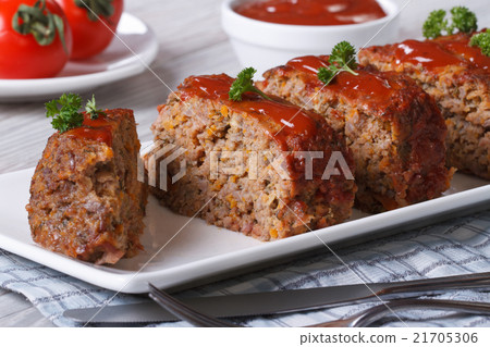 Sliced meat loaf with ketchup and parsley close-up 21705306
