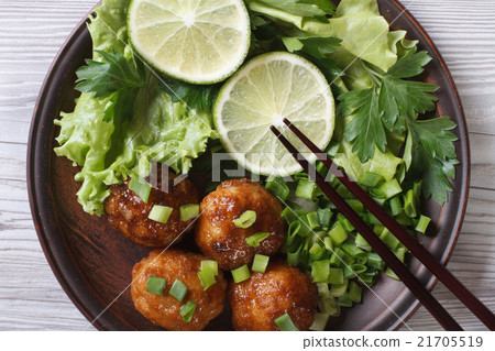 Fish balls with salad and chopsticks. top view Fish balls with salad and chopsticks. top view 21705519
