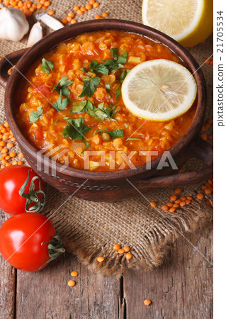 Red lentil soup with ingredients  vertical 21705534