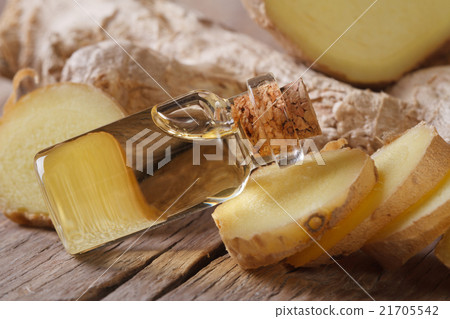 oil of ginger in a small glass bottle macro 21705542