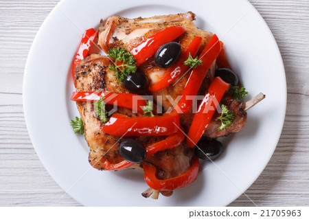 Rabbit leg meat fried with peppers and olives Rabbit leg meat fried with peppers and olives 21705963