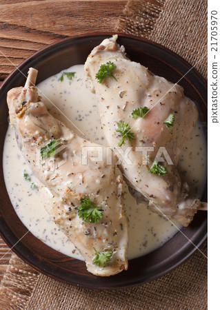Rabbit legs stewed in cream sauce vertical 21705970