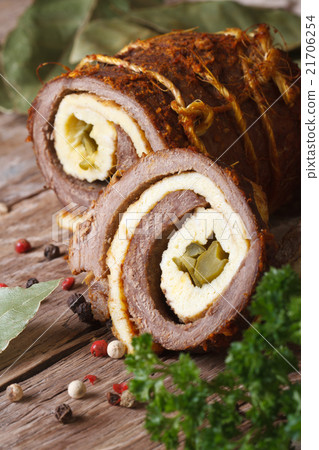 Meat roll stuffed with eggs and cucumber closeup Meat roll stuffed with eggs and cucumber closeup 21706254
