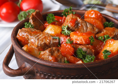 stew in tomato sauce with vegetables close up 21706267