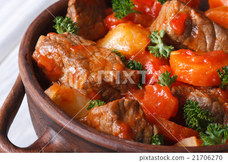 stew in tomato sauce with vegetables and herbs 21706270