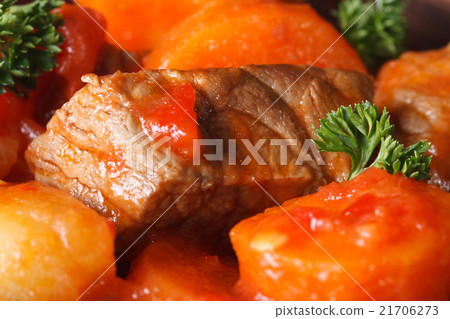 beef stew with vegetables in a tomato macro 21706273