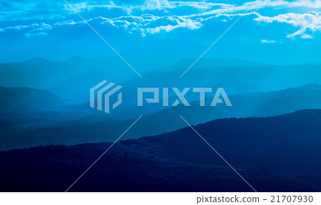 mountain silhouette with fog 21707930