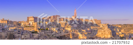 panoramic view of typical stones and church of Matera and the Madonna de Idris under begin sunset sky 21707932