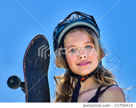 Girl holding a skateboard in hands. Girl holding a skateboard in hands. 21708418