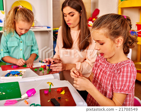Children are engaged in modeling clay. Children are engaged in modeling clay. 21708549