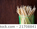 Wooden toothpicks on wood background isolate 21708841