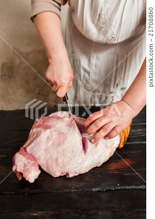 Slicing raw pork meat in farm market Slicing raw pork meat in farm market 21708860
