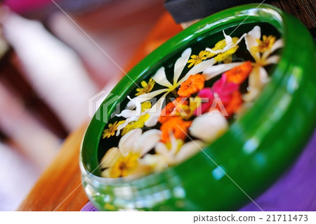 water cup with beautiful flowers background water cup with beautiful flowers background 21711473