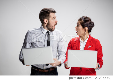 The young businessman and businesswoman with 21714559