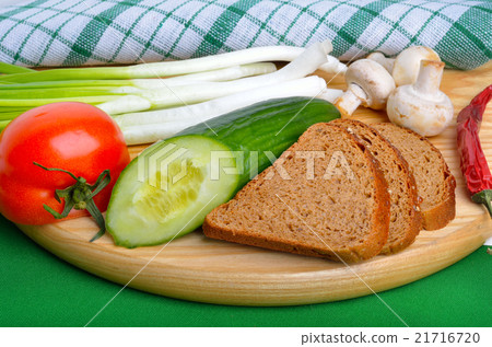 vegetables, bread on cutting board 21716720