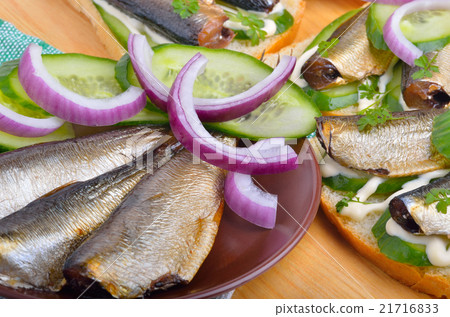 Appeizer with sprats and green cucumber Appeizer with sprats and green cucumber 21716833