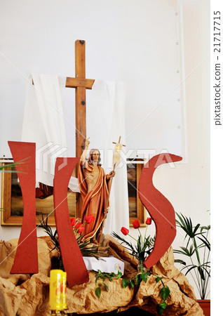 Wooden cross and Jesus figure decor in church Wooden cross and Jesus figure decor in church 21717715