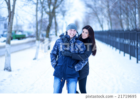 Beautiful adult couple love, park in winter 21719695