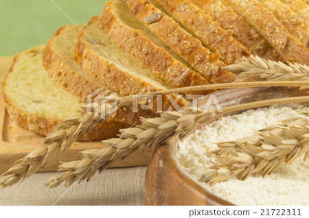 Sliced bread, the flour in wooden bowl  21722311