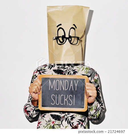 man with a chalkboard with the text monday sucks 21724697