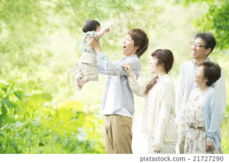 Three generations family smiling in fresh green 21727290
